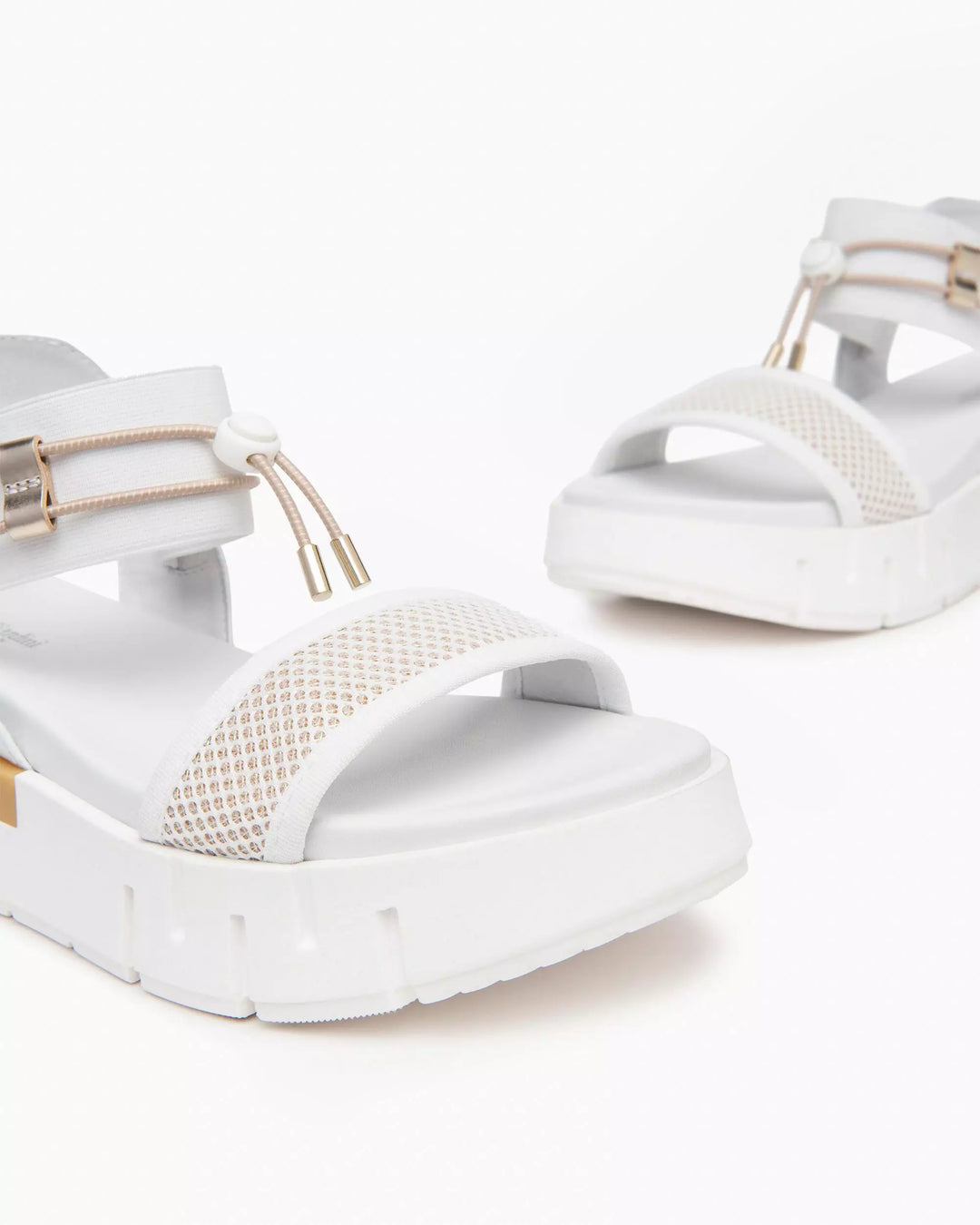 NeroGiardini Chey Bungee Platform Flat Sandal in White available at Barbara Katz