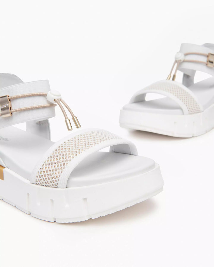 NeroGiardini Chey Bungee Platform Flat Sandal in White available at Barbara Katz