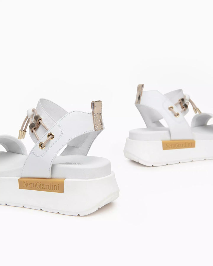 NeroGiardini Chey Bungee Platform Flat Sandal in White available at Barbara Katz