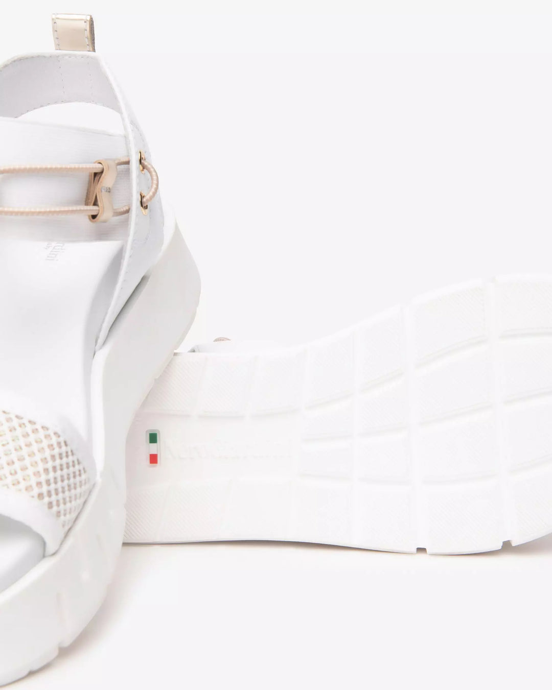 NeroGiardini Chey Bungee Platform Flat Sandal in White available at Barbara Katz