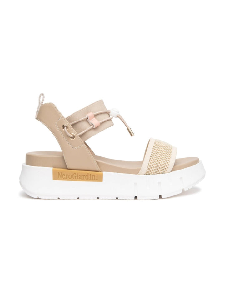 Nero Giardini Bungee Platform Flat Sandal in Beige available atBarbara Katz