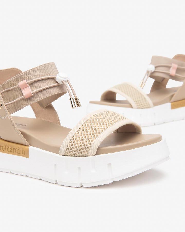 Nero Giardini Bungee Platform Flat Sandal in Beige available atBarbara Katz