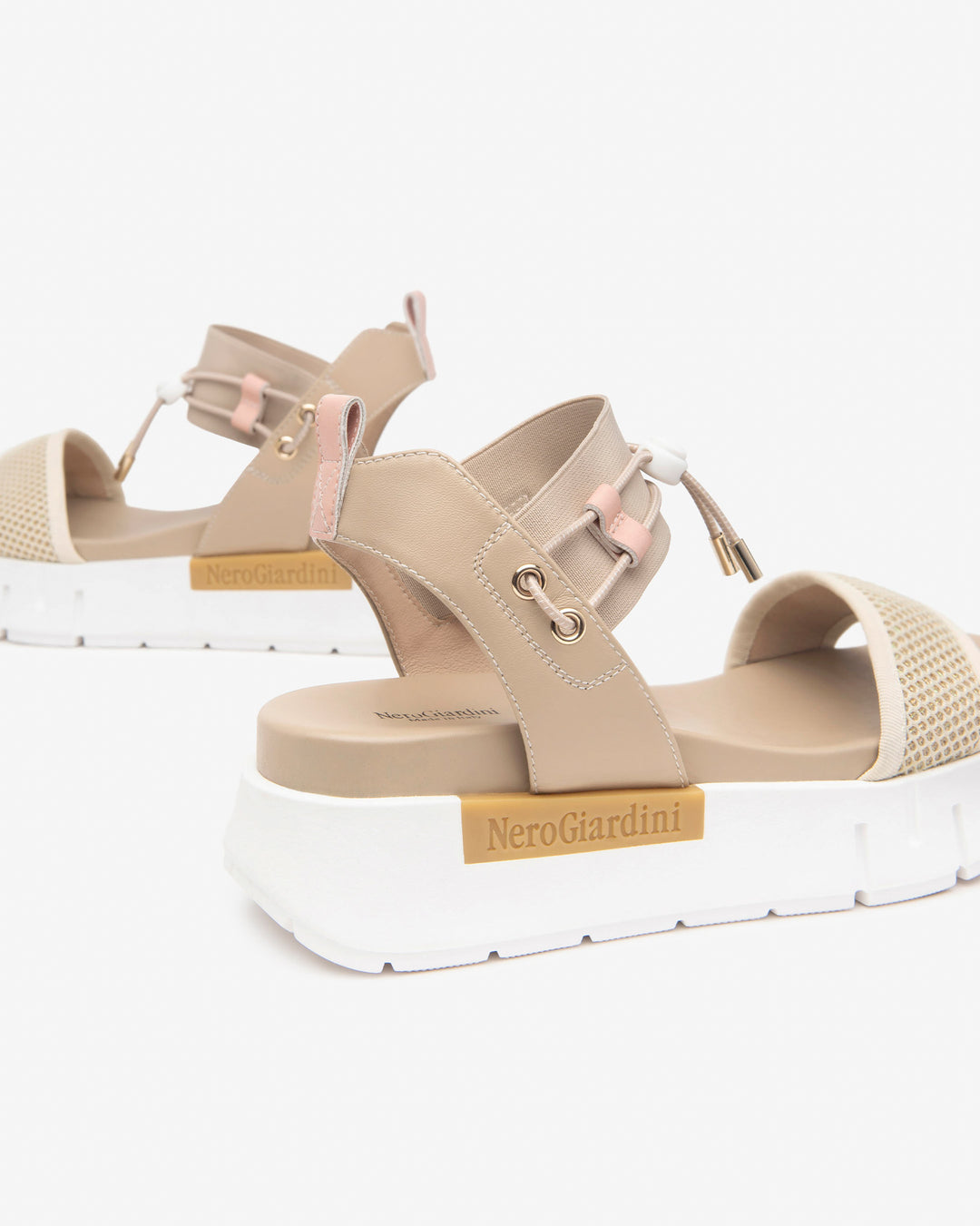 Nero Giardini Bungee Platform Flat Sandal in Beige available atBarbara Katz