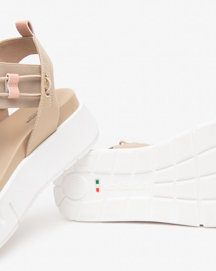 Nero Giardini Bungee Platform Flat Sandal in Beige available atBarbara Katz