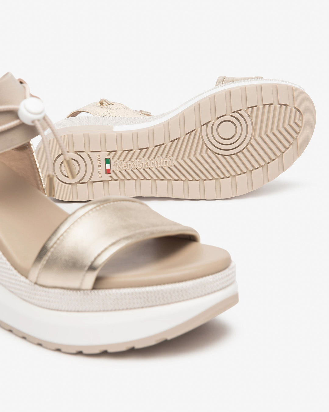 NeroGiardini Satcha Bungee Platform Wedge Sandal in Gold available at Barbara Katz