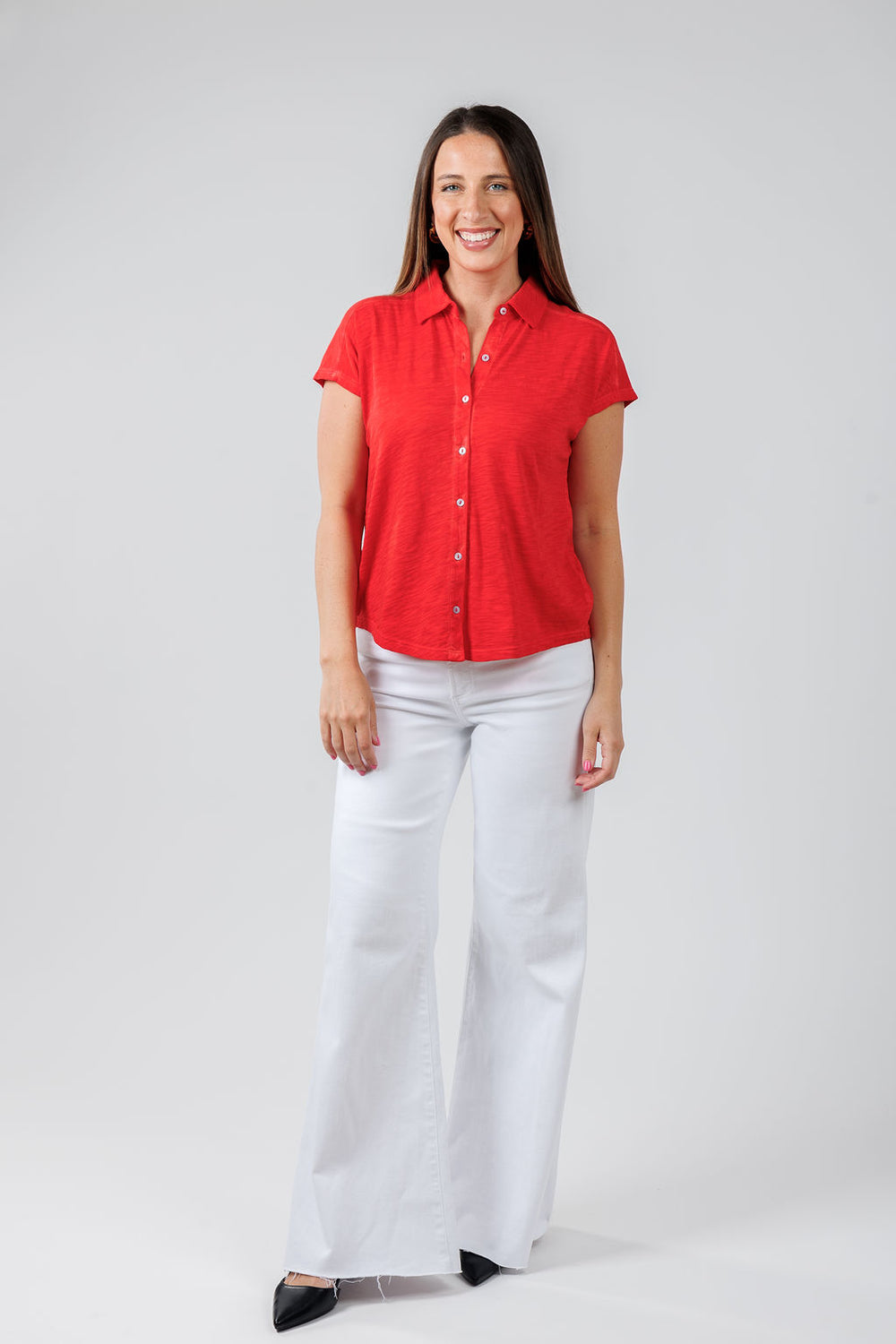 Elliott Lauren Charlotte Button Front Tee With Collar in Poppy paired with Izzy Mid Rise Wide Leg Crop Jeans in Vivid White available at Barbara Katz
