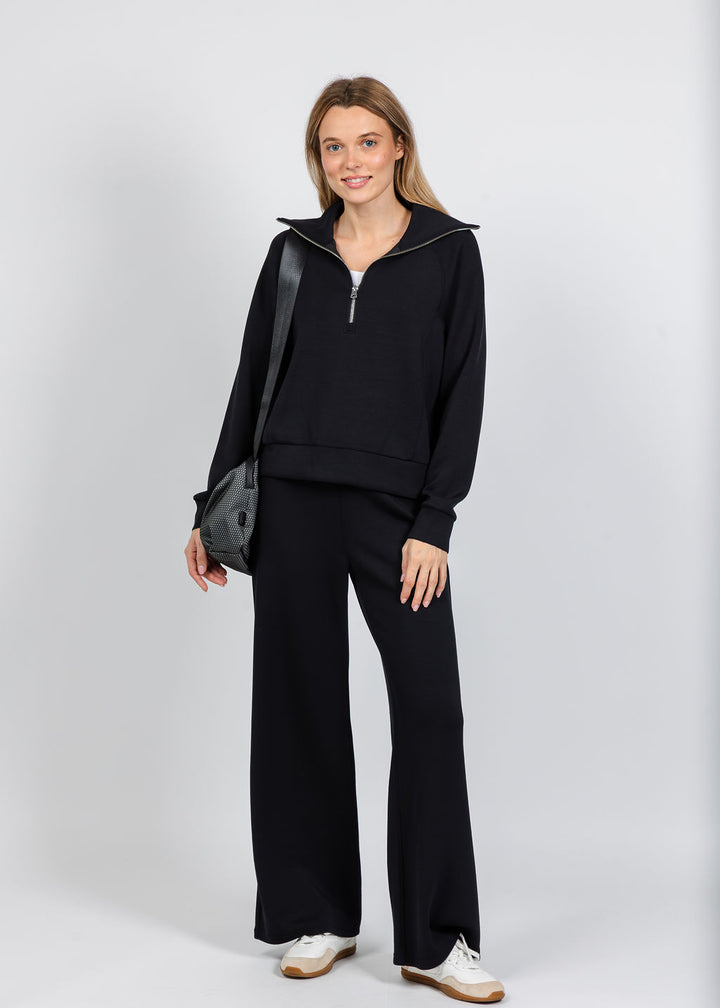 Elliott Lauren Comfort Zone Half Zip Seam Top in Black paired with matching  Comfort Zone Wide Leg Pants available at Barbara Katz