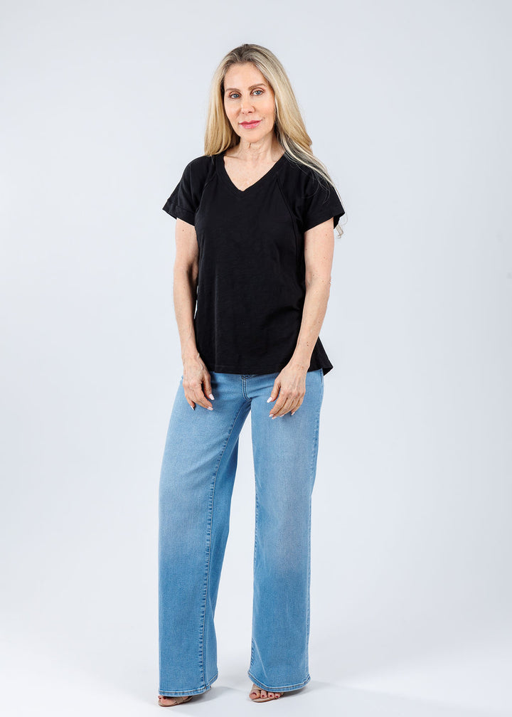 Elliott Lauren Tina Raglan Short Sleeve V-Neck Tee in Black paired with Frame Le Slim Palazzo Jeans in Honeymoon available at Barbara Katz