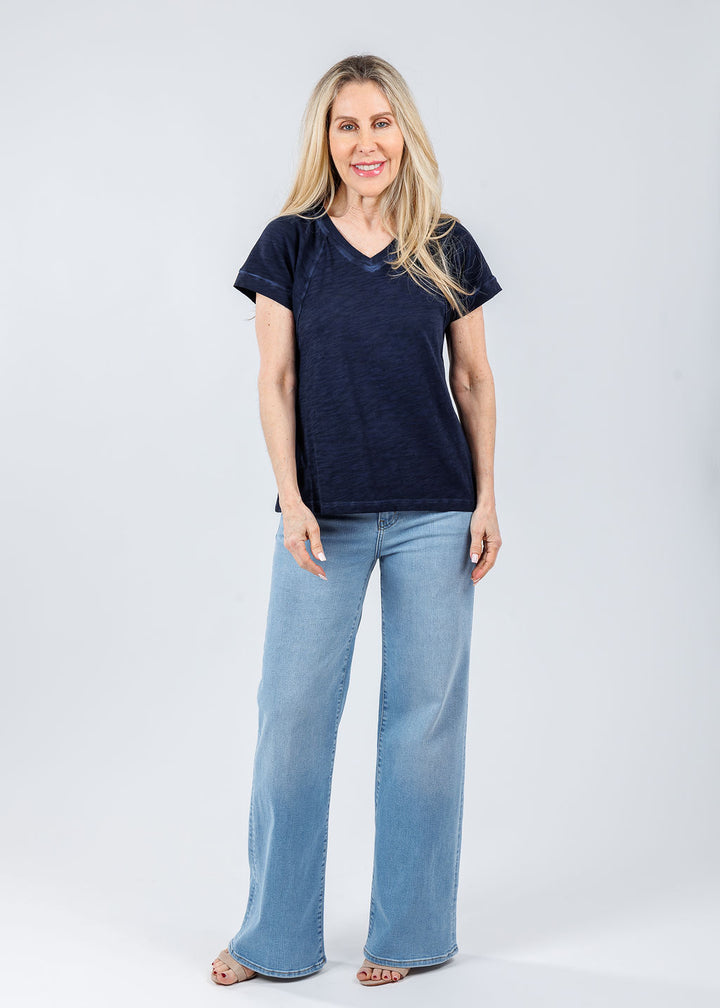 Elliott Lauren Tina Raglan Short Sleeve V-Neck Tee in Navy paired with Frame Le Slim Palazzo Jeans in Honeymoon available at Barbara Katz