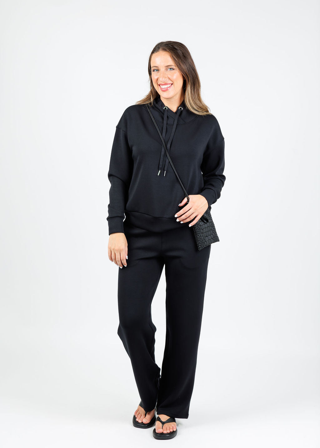 Elliott Lauren Comfort Zone Cowl Sweater in Black paired with matching Comfort Zone Sweatpants available at Barbara Katz