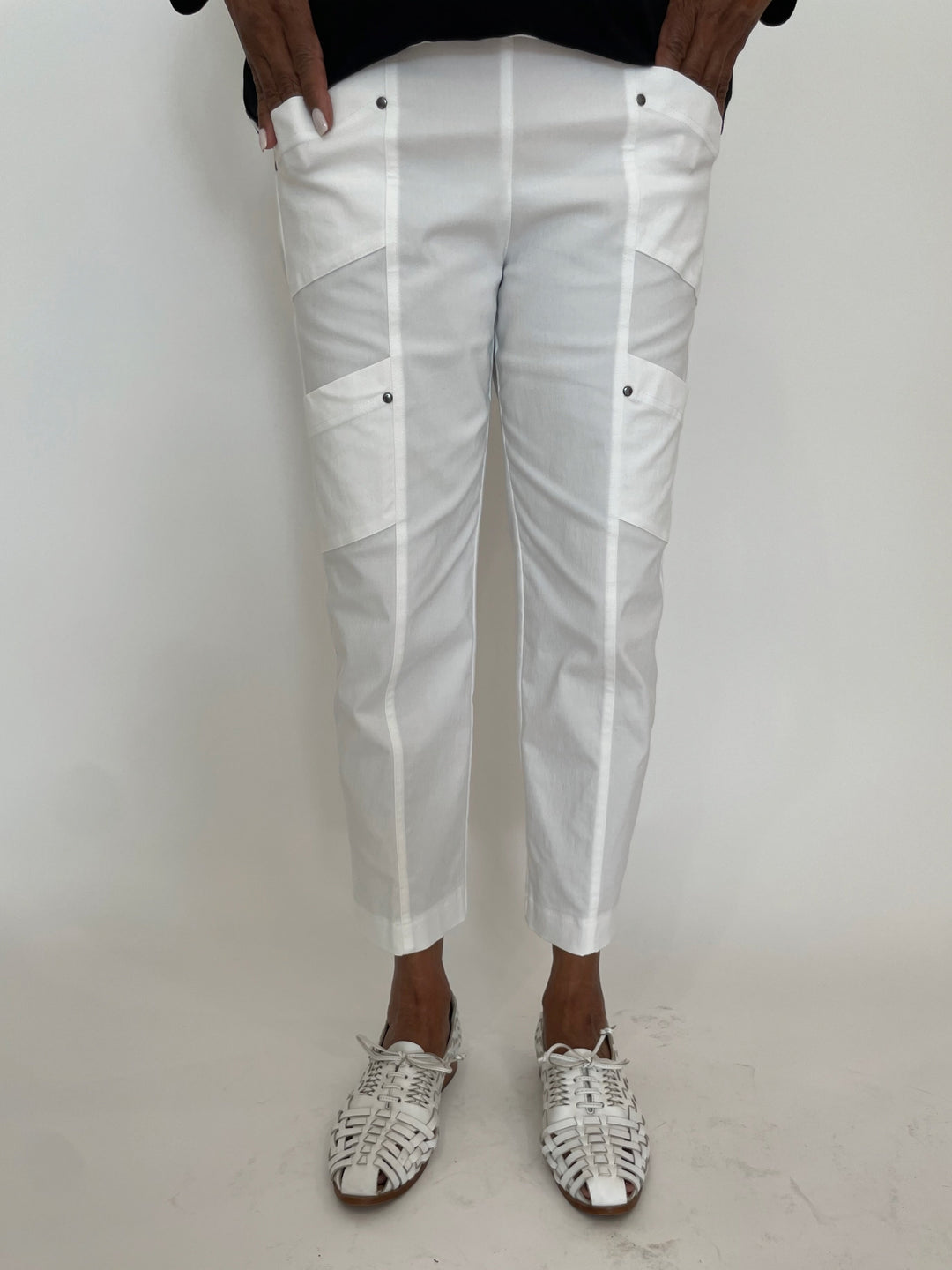 Elliott Lauren Crop Cargo Pants in White available at Barbara Katz. Elliott Lauren classic pull-on pants with elastic waistband, cargo pockets, rivet details, straight leg, and cropped length.