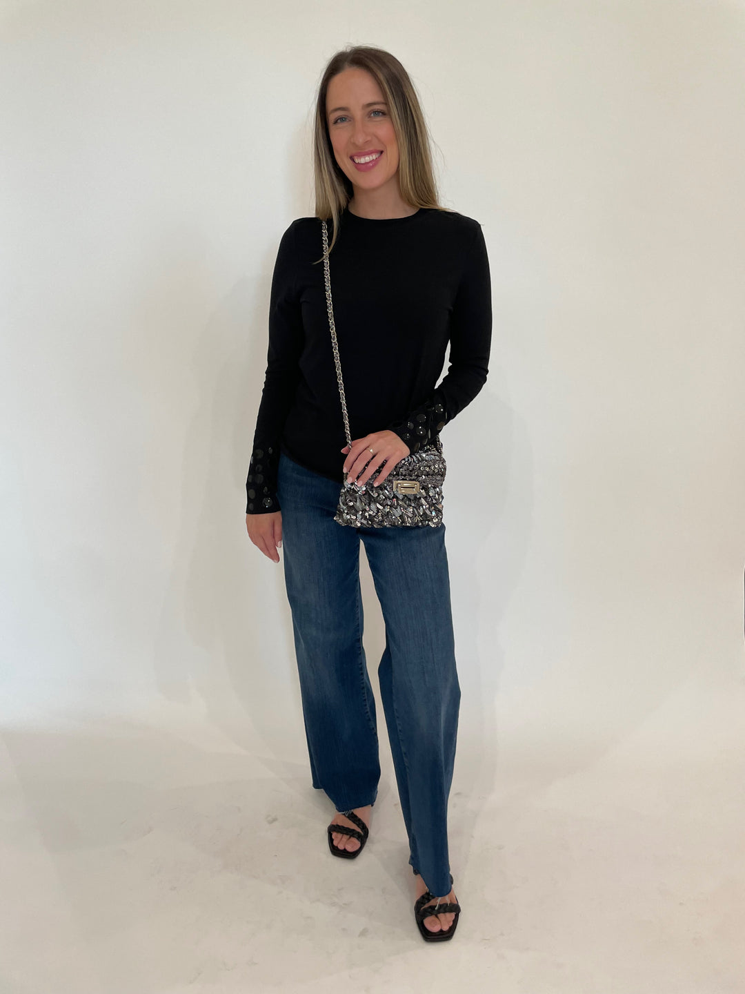 Suzy T Stud T-Shirt in Black paired with Frame Le Slim Palazzo Raw After Jeans in Lupine, Lorenza Gandaglia Corolle 1 Two Tones Bag in Dark Grey Combo
 available at Barbara Katz