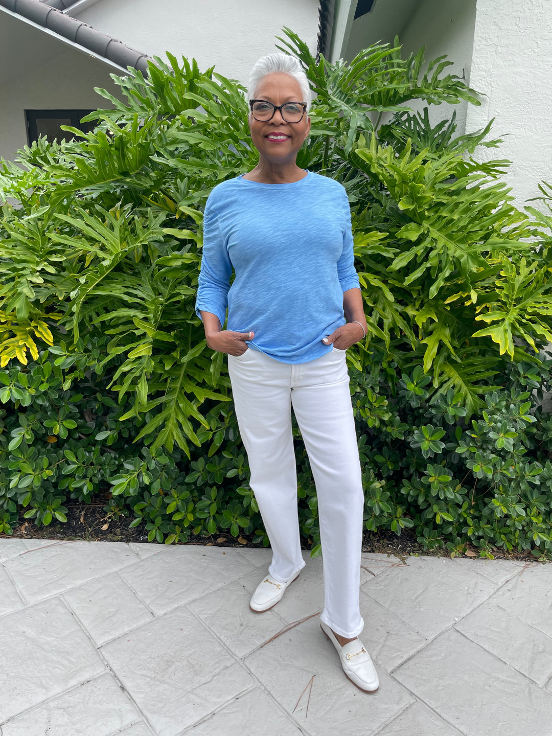 Elliott Lauren Hannah Crew Neck Ruched Sleeve Tee in Denim paired with Citizens of Humanity Palma Straight Jeans in Soft White available at Barbara Katz