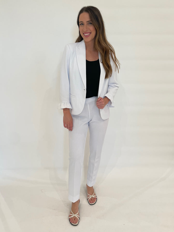 Peace of Cloth Gia Pique Jacket in White with Hinson Wu black Scoop Neck Tank Top underneath, paired with Annie Pique Pants in White available at Barbara Katz