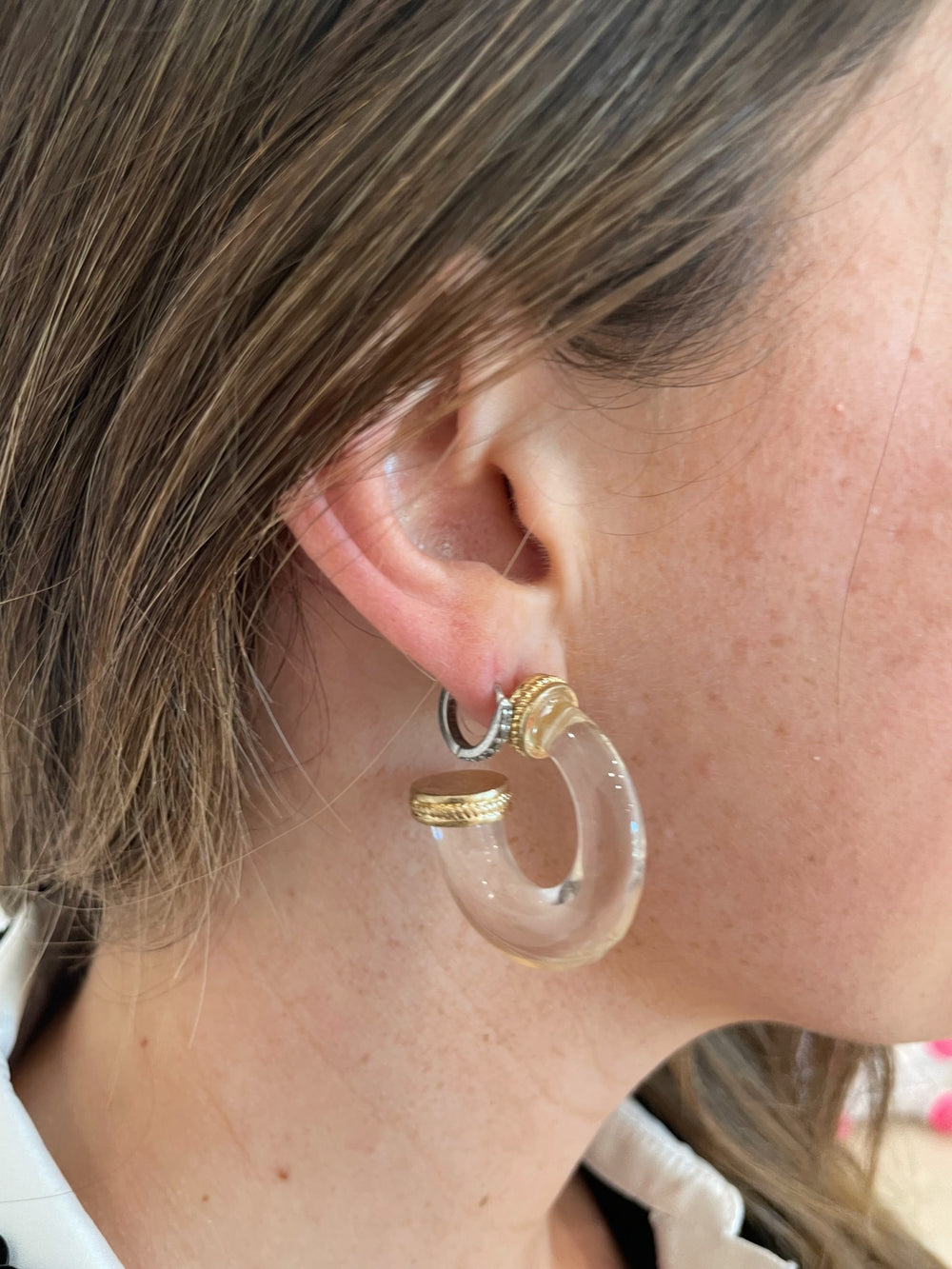 BK Jewelry Mika Metal Accent Clear Hoop Earrings in Clear/Vintage Gold available at Barbara Katz