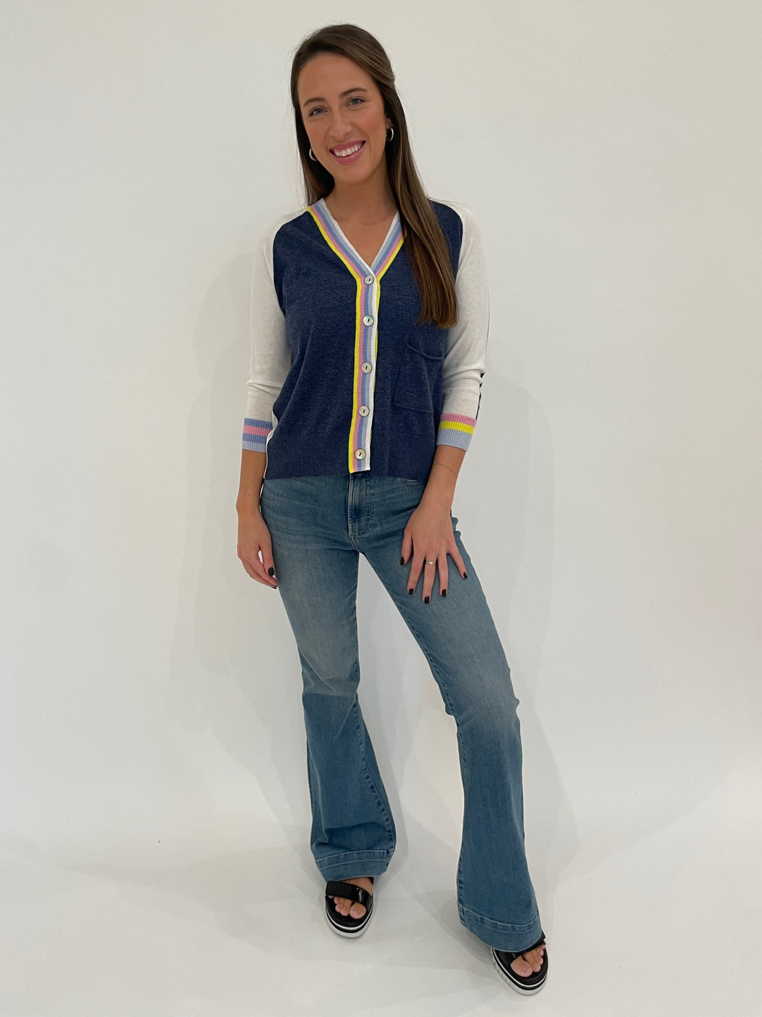 Zaket & Plover Aida Rainbow Stripe V-Neck Cardigan in Denim paired with Pistola Kinsley Ultra Flare Jeans in Essay available at Barbara Katz