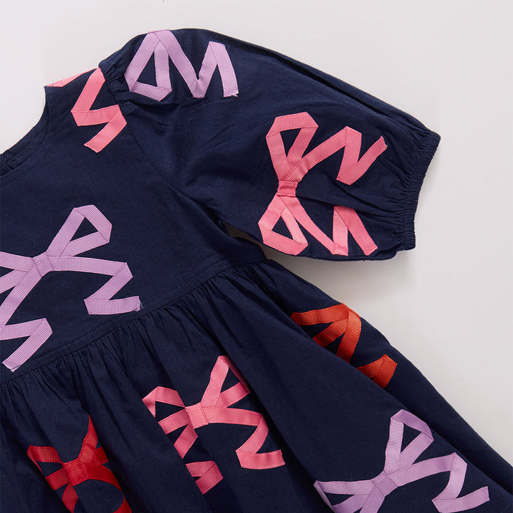 Pink Chicken Girls Brooke Dress in Multi Bow Applique available at Barbara Katz