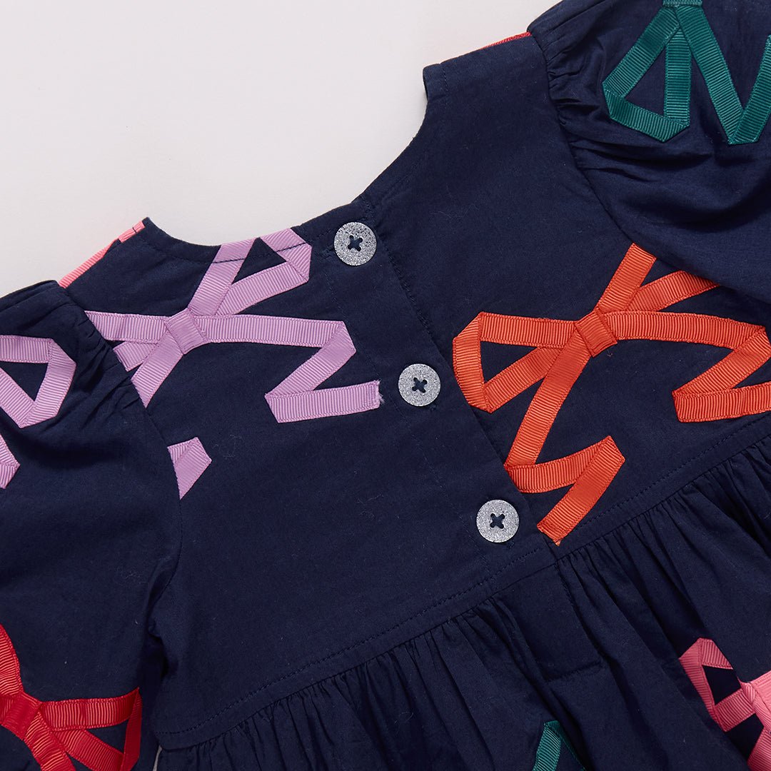 Pink Chicken Girls Brooke Dress in Multi Bow Applique available at Barbara Katz