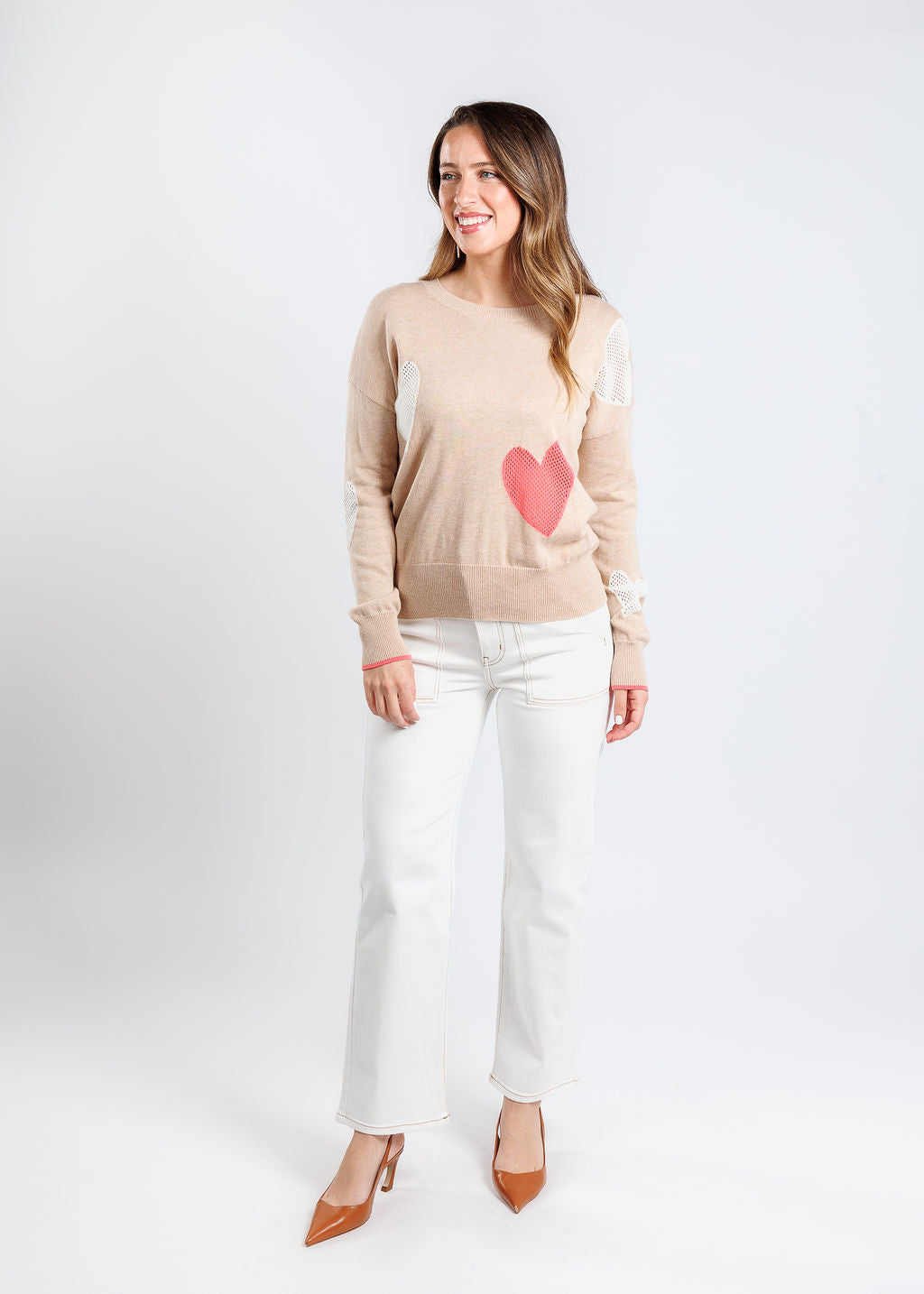 Whisper by Brodie Eve Quirky Heart Victory Crew Sweater in Crema paired with Frame The Trapunto Straight Denim Trouser in Au Natural Clean available at Barbara Katz