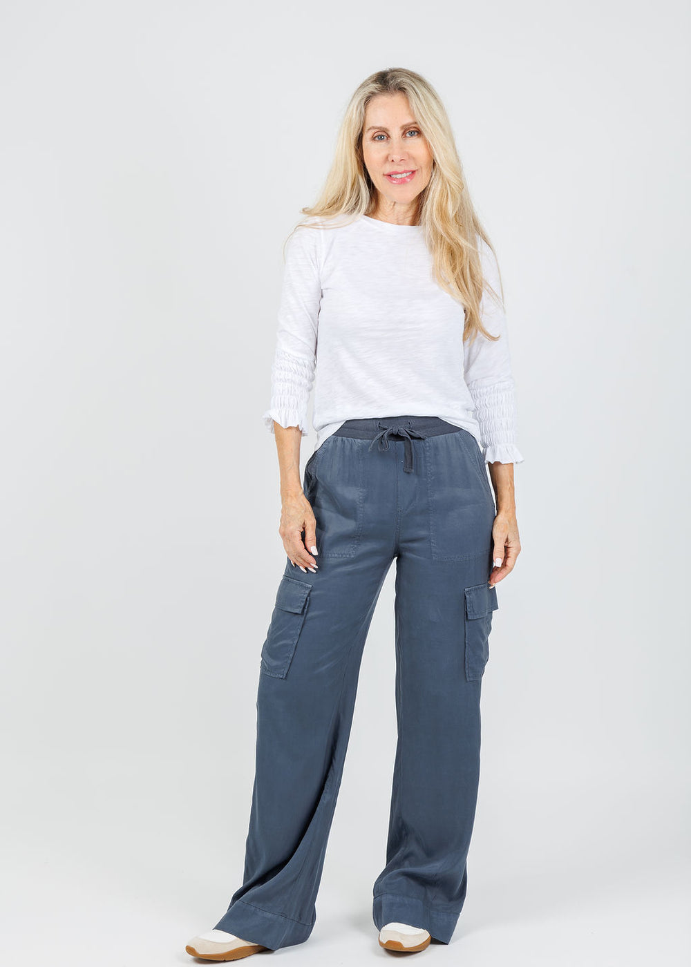 Goldie Madeline Smocked 3/4 Sleeve Top in White paired with Marrakech  Caracas Stretch Cupro Wide Leg Cargo Pants in Cruise available at Barbara Katz