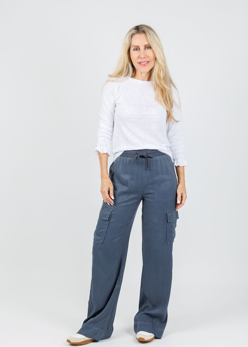 Goldie Madeline Smocked 3/4 Sleeve Top in White paired with Marrakech  Caracas Stretch Cupro Wide Leg Cargo Pants in Cruise available at Barbara Katz