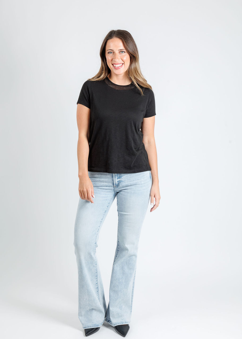 Goldie Soleil Slub Fishnet Boy Tee in Black paired with Kinsley Mid Rise Ultra Flare Jeans in Serenity available at Barbara Katz