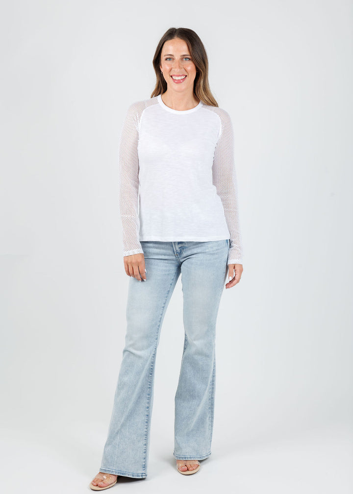 Goldie Soleil Saddle Fishnet Long Sleeve Top in White paired with Kinsley Mid Rise Ultra Flare Jeans in Serenity available at Barbara Katz