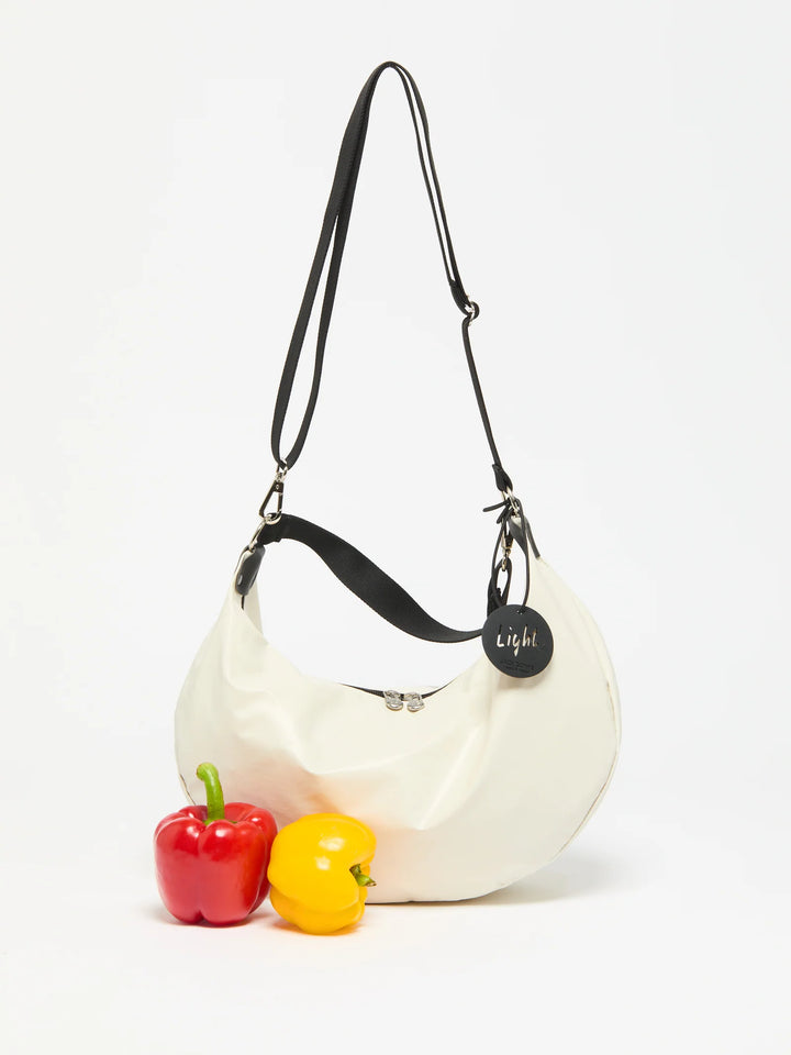 Jack Gomme Charlie Half Moon Bag in Matte Ecru available at Barbara Katz