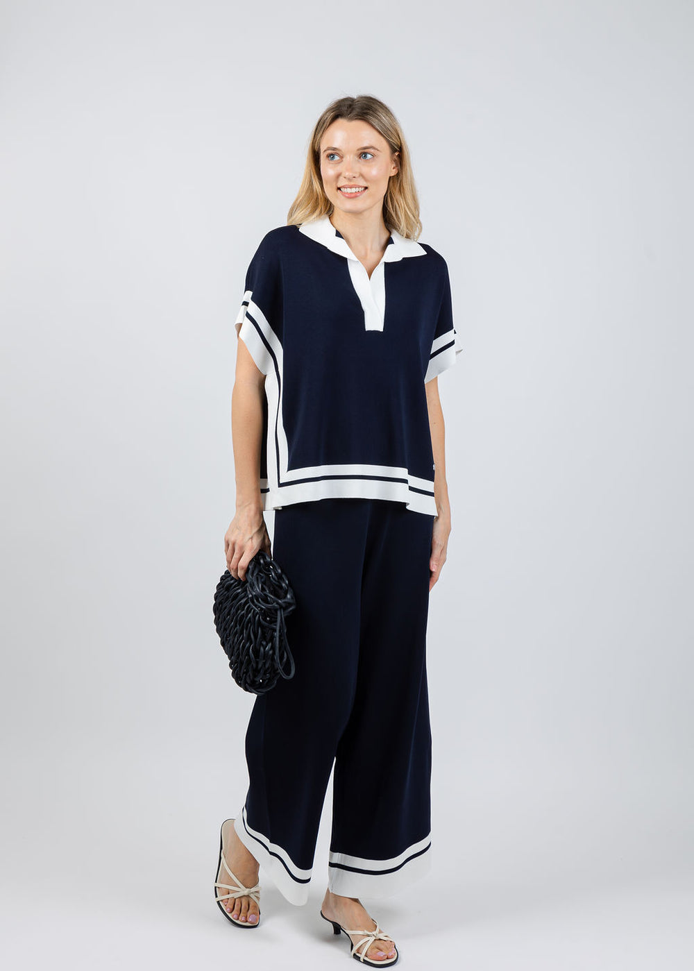 Joseph Ribkoff Boxy Collared Sweater With Stripe Detail in Midnight Blue/Vanilla paired with matching Culotte Pants available at Barbara Katz