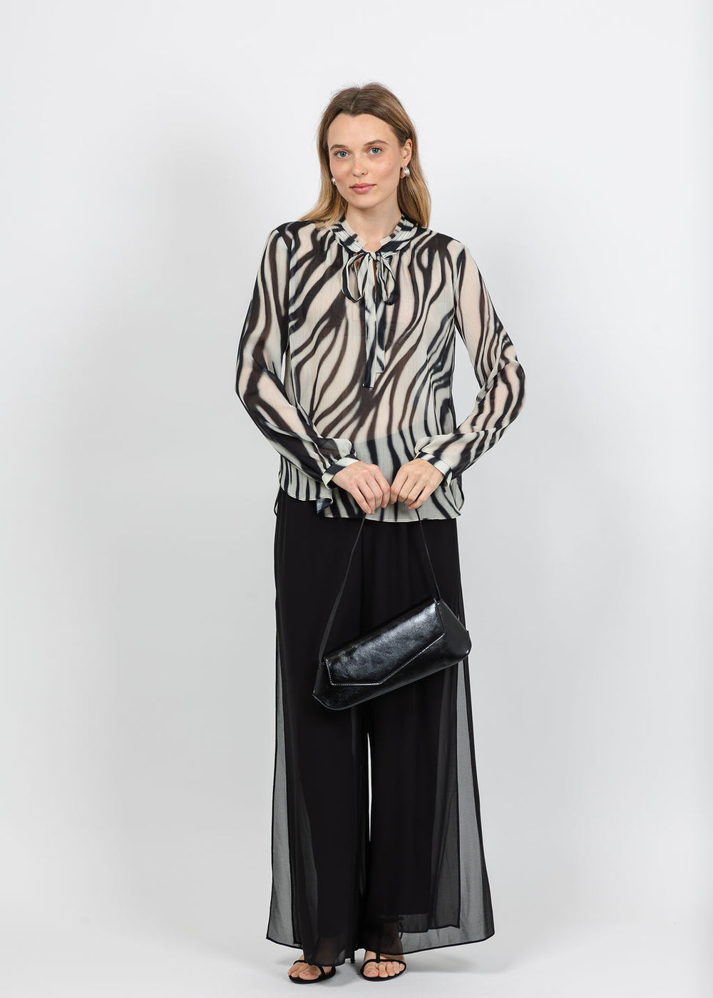 Joseph Ribkoff Animal Print Chiffon Tie-Neck Blouse in Off White/Black paired with Chiffon Wide-Leg Pull-On Pants in Black available at Barbara Katz