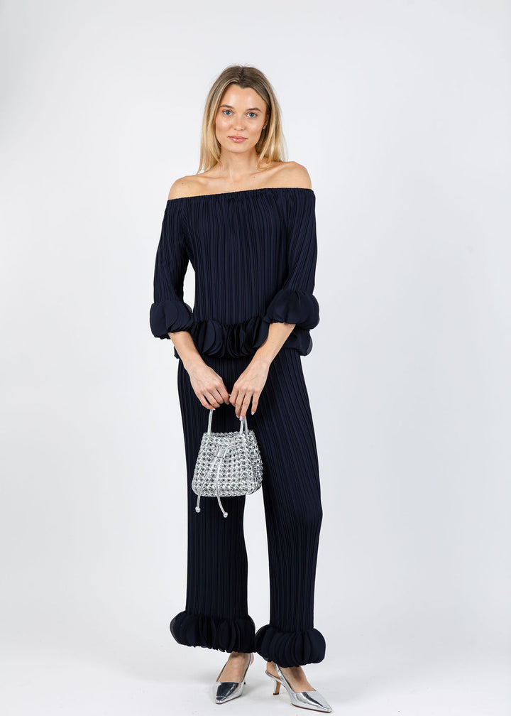 Joseph Ribkoff Joa Ruffle Out Of Shoulder Top and Joa Ruffle Pants in Navy available at Barbara Katz
