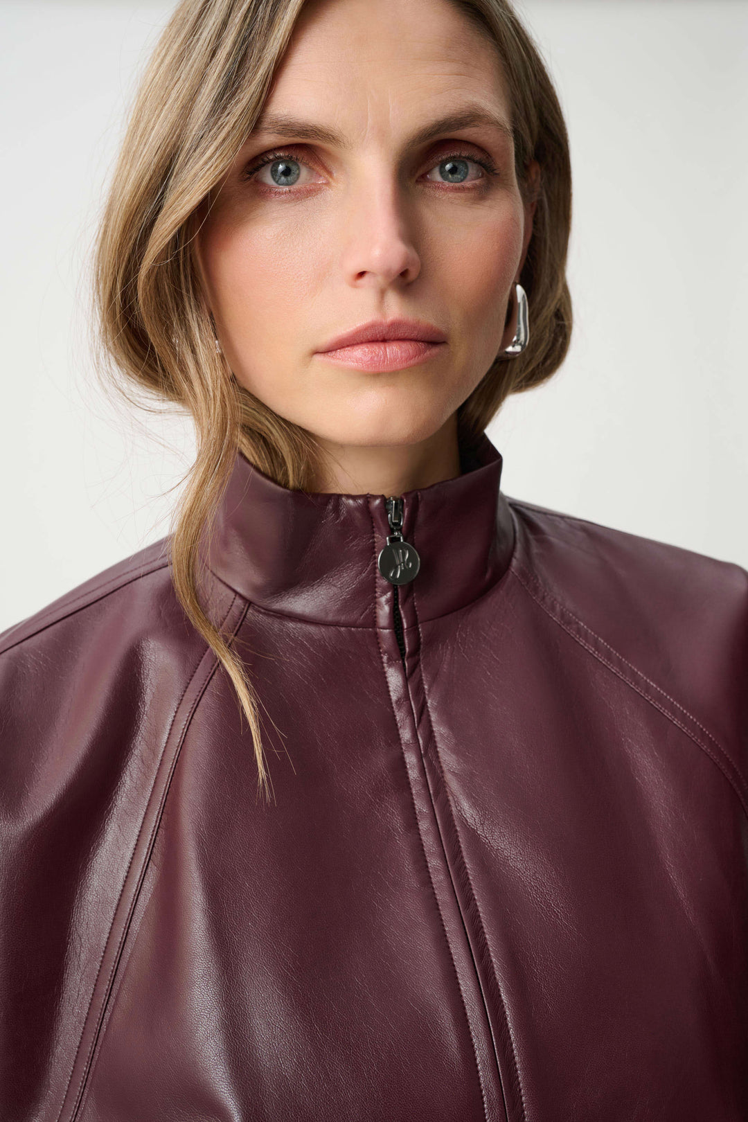 Joseph Ribkoff Leatherette Mock-Neck Bomber Jacket in Burgundy available at Barbara Katz