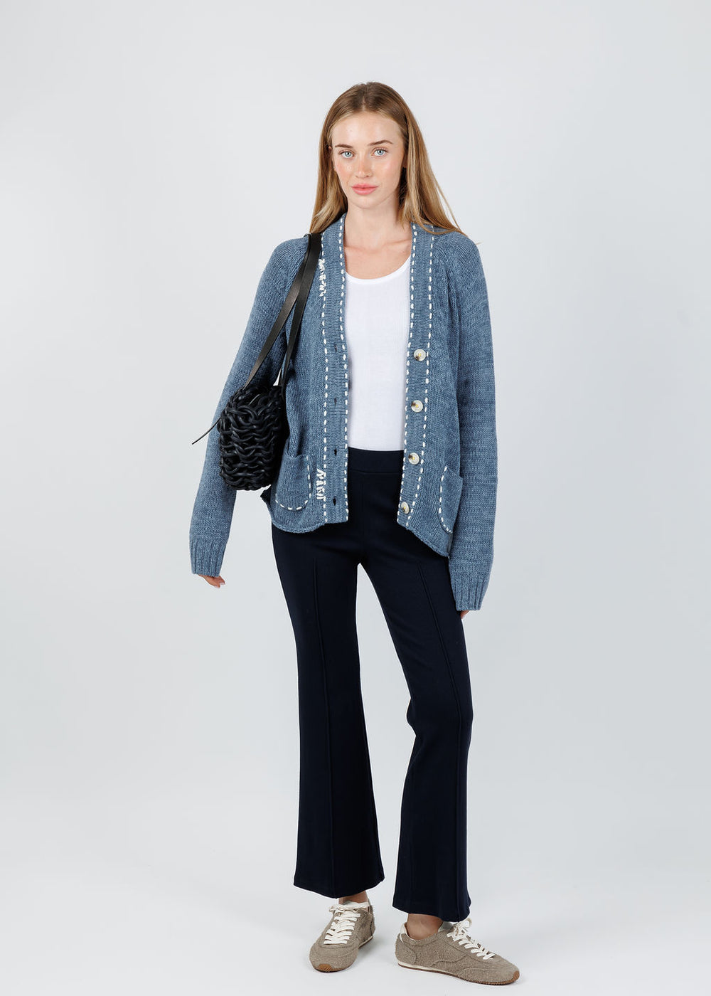 Kerri Rosenthal Short Poppy Smiley Cardigan in Indigo Blue paired with Donni The Rib Flared Pants in Navy available at Barbara Katz