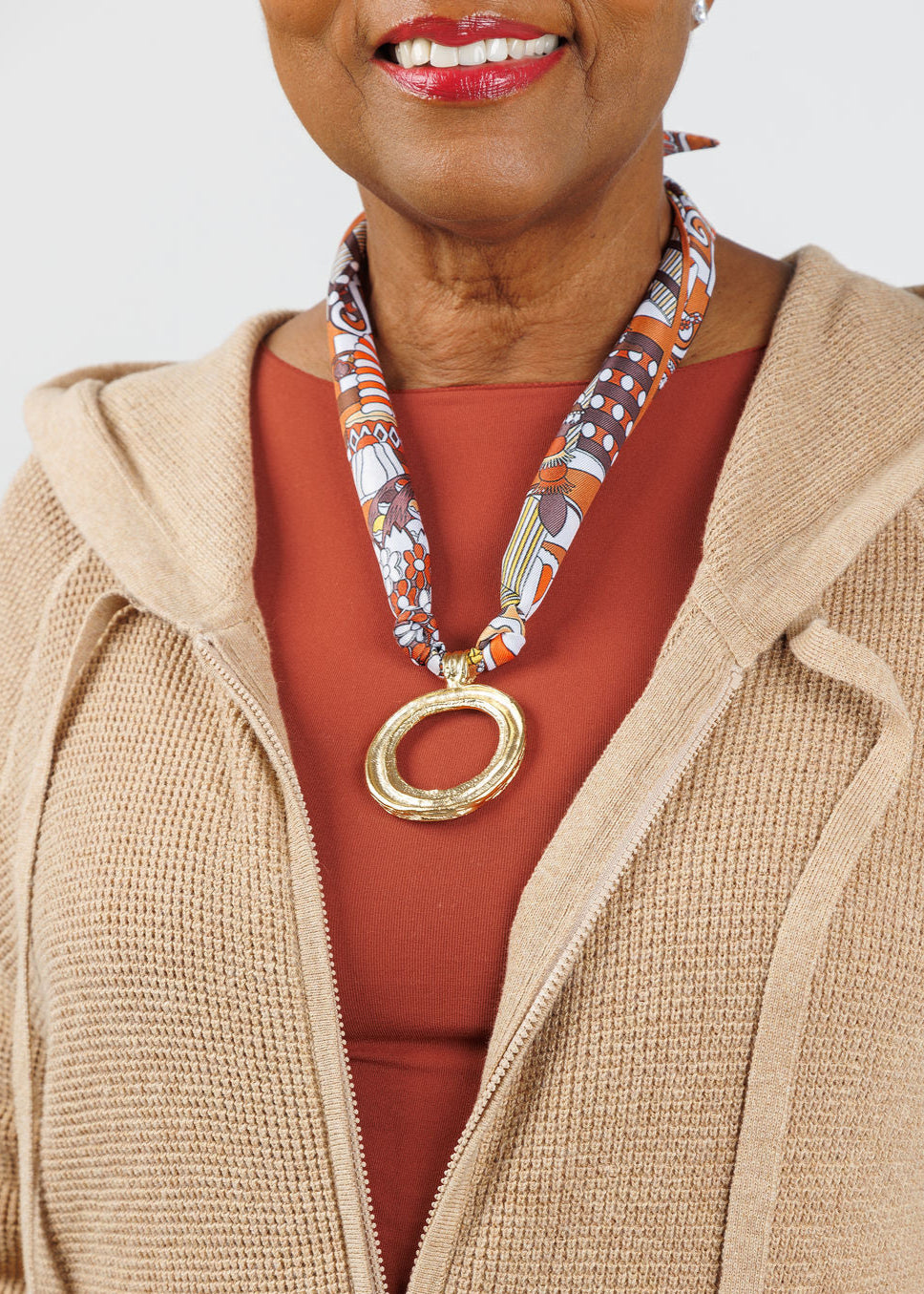 Knotty Bling Gold Circle Bandana Scarf Necklace in Brown/Orange available at Barbara Katz