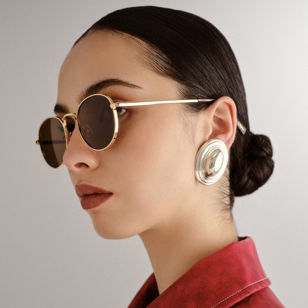 Le Specs Lost Legacy Sunglasses in Gold available at Barbara Katz