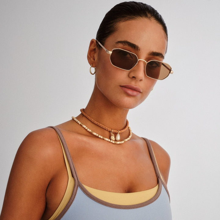 Le Specs Mythic Sunglasses in Gold available at Barbara Katz