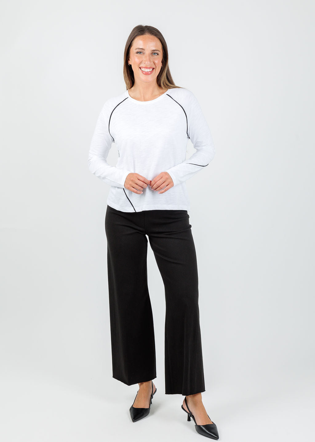 Lisa Todd Piping Hot Tee in White paired with  Erin High Waist Wide Leg Denim Pants in Black available at Barbara Katz