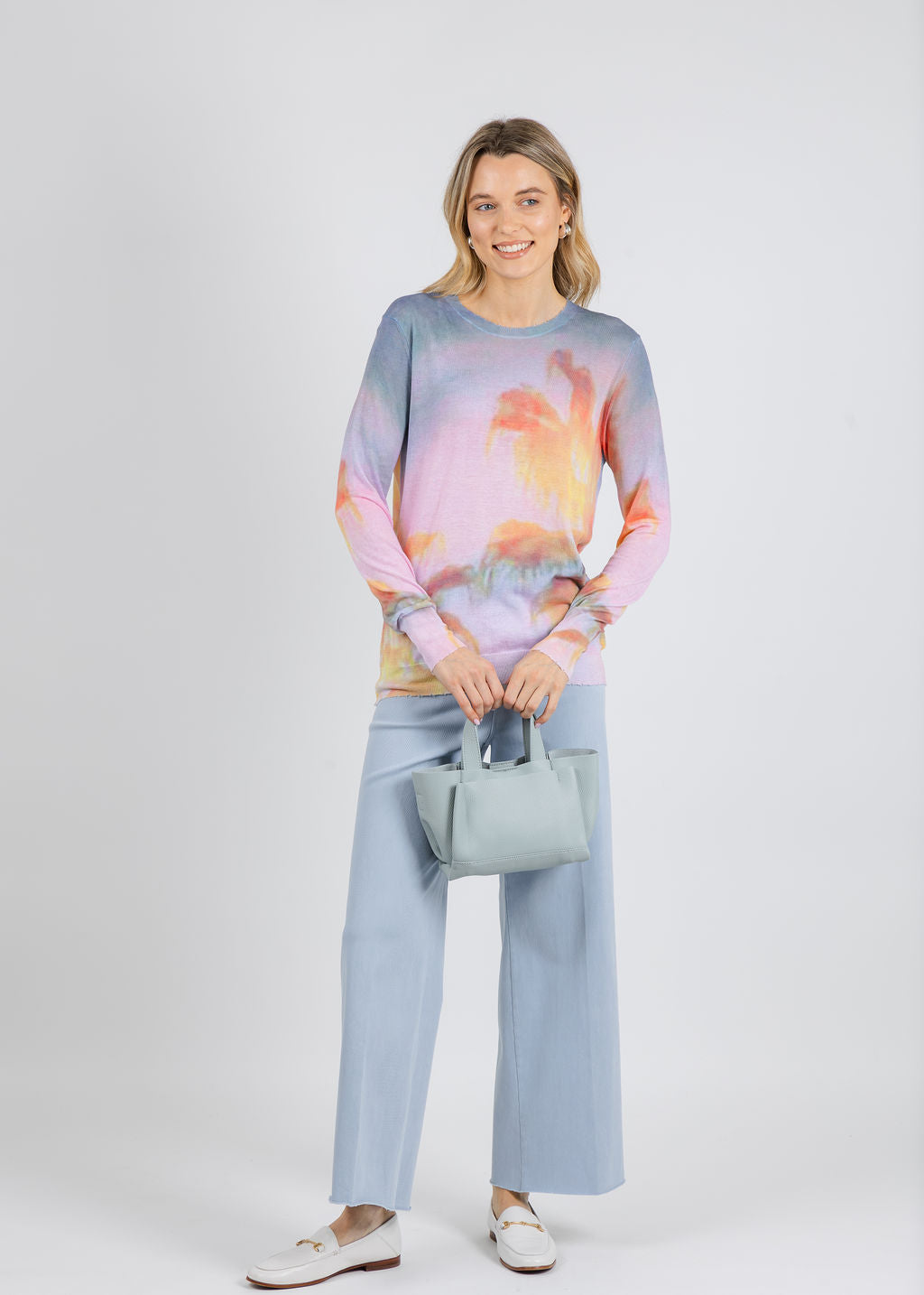 Autumn Cashmere Palm Print Long Sleeve Crew Sweater in Purple/Orange Combo paired with Lysse Erin High Waist Wide Leg Denim Pants in Chalk Blue available at Barbara Katz