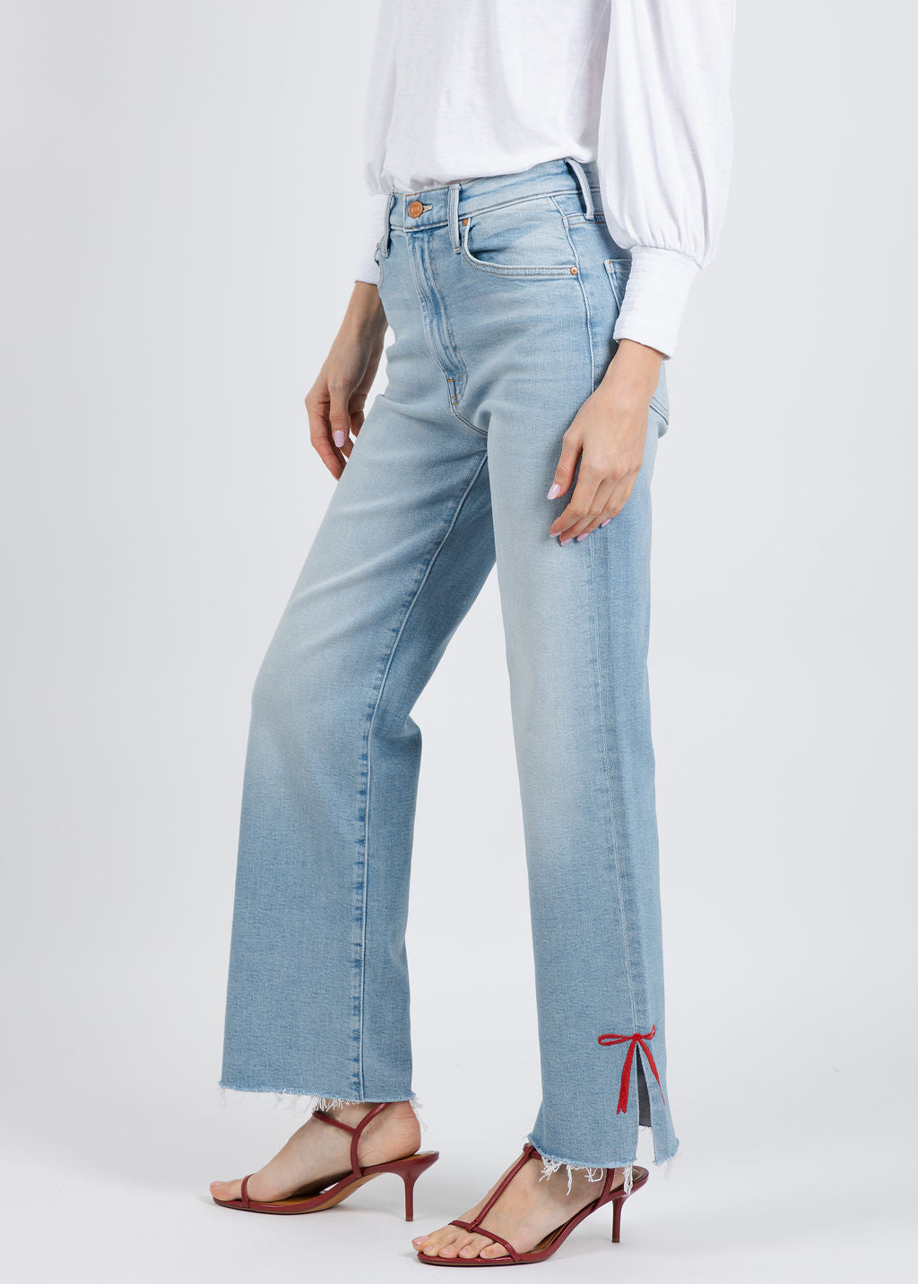 Mother The Rambler Zip Slice Hover Fray Jeans in Complete 360 available at Barbara Katz