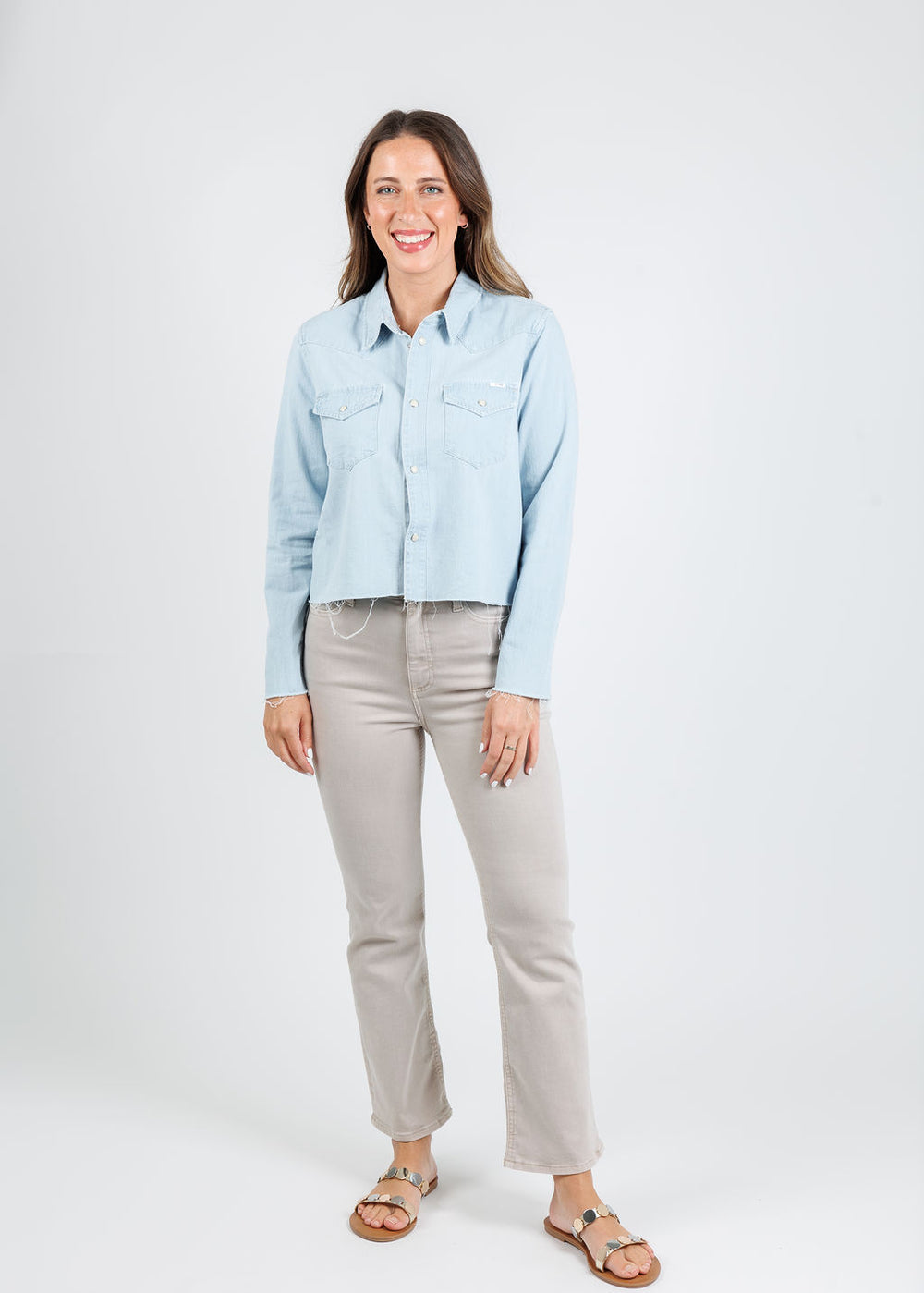 MOTHER The Super Ex's Crop Fray Jacket in No End In Sight paired with Pistola Lennon Crop Flare Jeans in Stone available at Barbara Katz