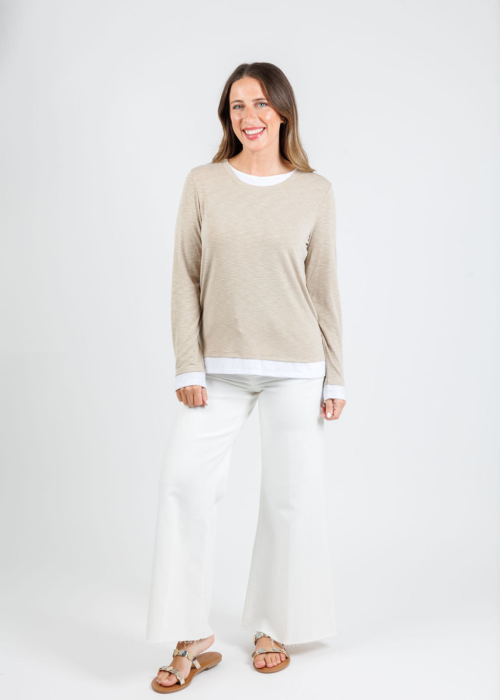 Nally & Millie Lucy Long Sleeve Layered Tee in Khaki paired with Frame Le Palazzo Crop Jeans in Au Natural Clean Raw After available at Barbara Katz