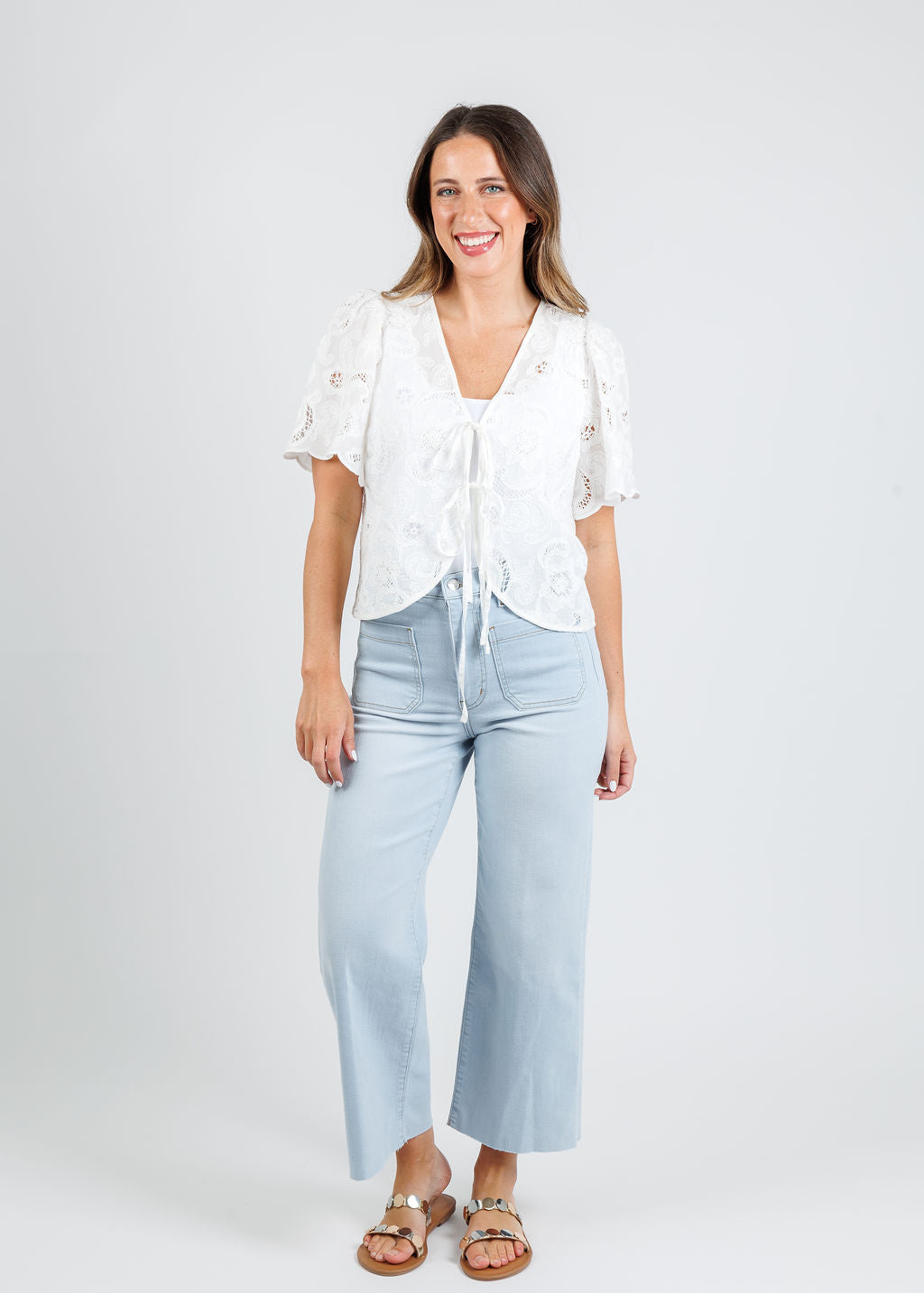 Nation Rosalyn Tie Front Top in White paired with Frame The Anchor Pants in Float Raw Fray available at Barbara Katz