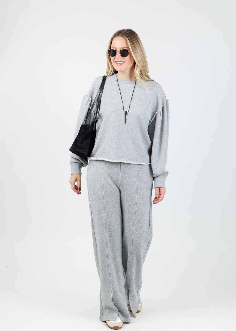 Nation Shane Sweatshirt in Heather Grey paired with matching Lincoln Front Slit Knit Pants available at Barbara Katz