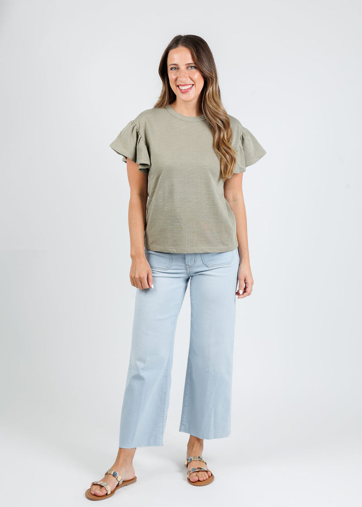 Nation Los Angeles Camille Ruffle Sleeve Top in Herb paired with Frame The Anchor Pants in Float Raw Fray available at Barbara Katz