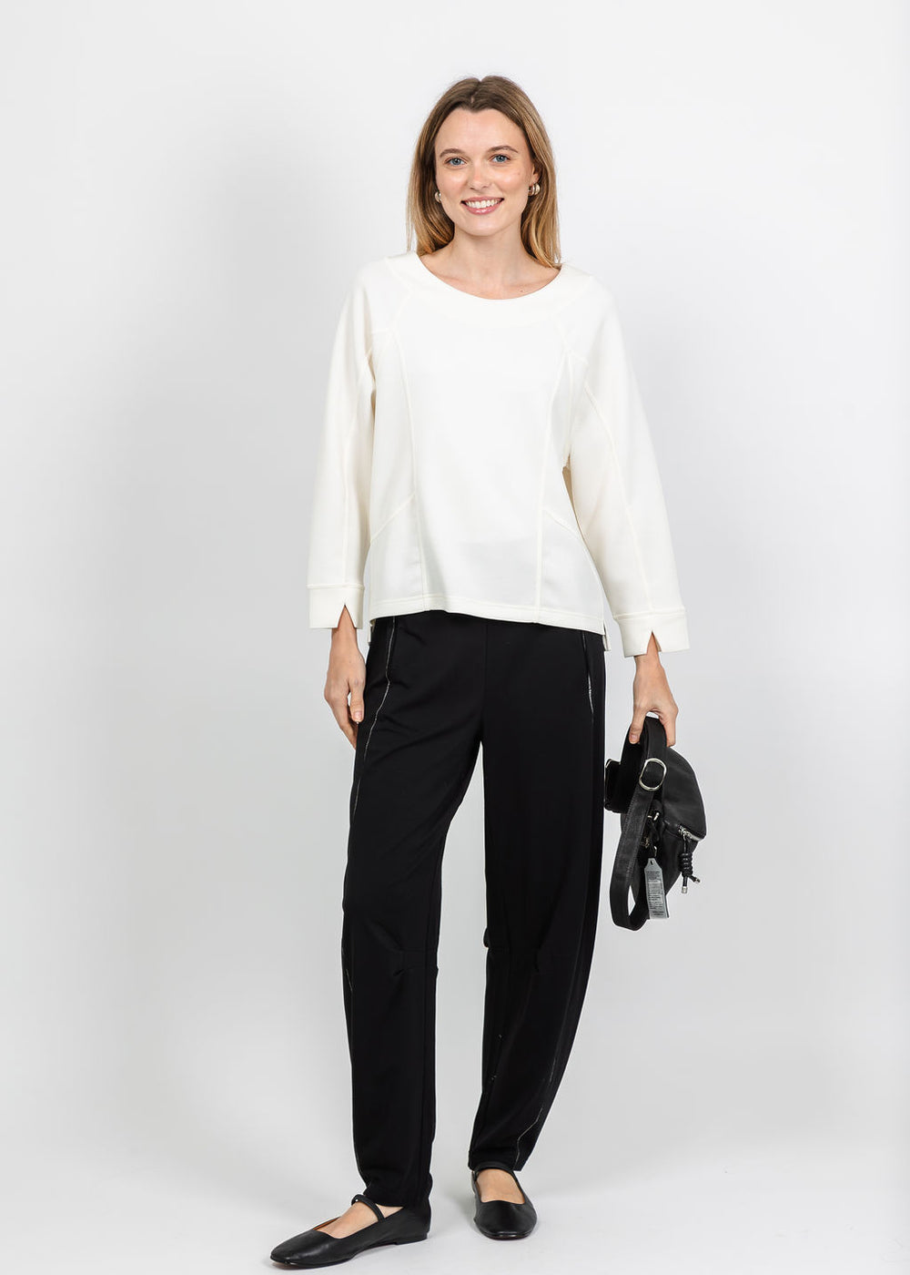 Olivia by Habitat Border Stitch Pullover Sweater in Ivory and Essential Layers Barrel Pant in Black available at Barbara Katz