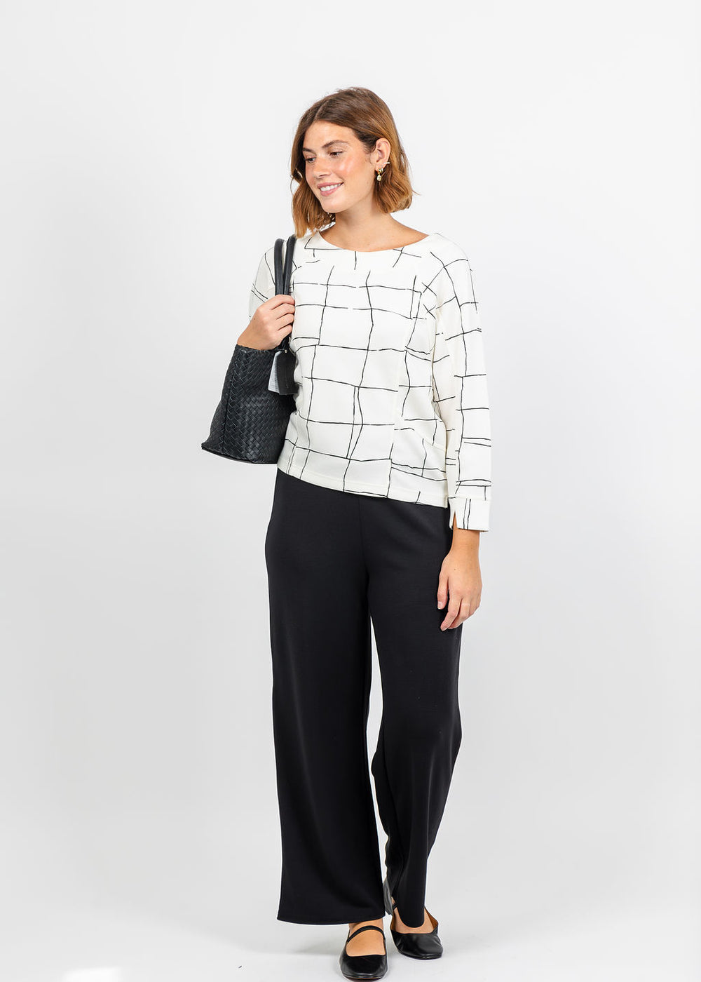 Olivia by Habitat Knit Print Pullover in Ivory paired with Olivia by Habitat Knit Trek Pant in Black available at Barbara Katz