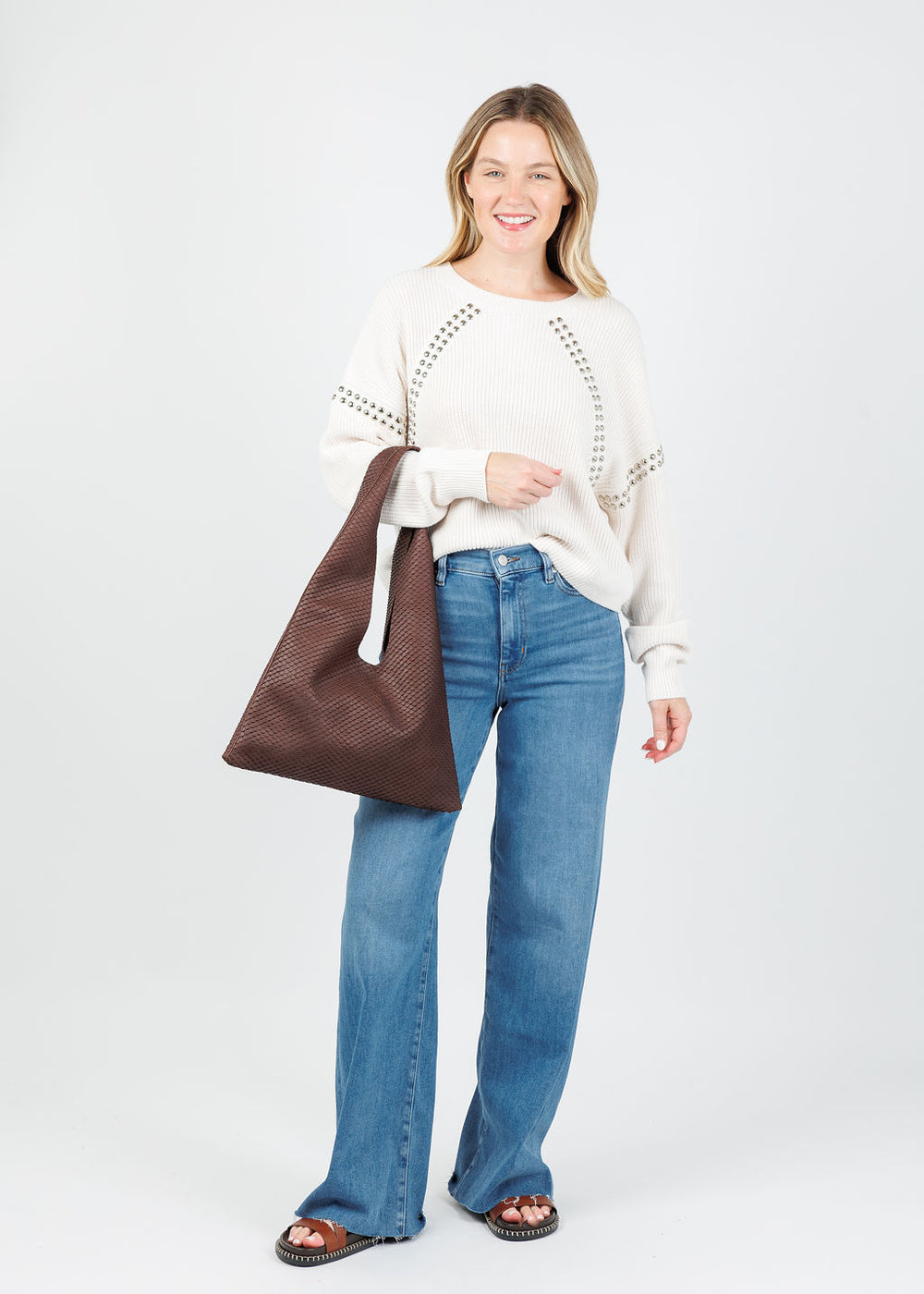 Oui Ingrid Studs Pullover in Gardenia paired with Frame Le Slim Palazzo Jeans in Flip Raw After, Streets Ahead Modern Hobo in Chocolate Boa available at Barbara Katz