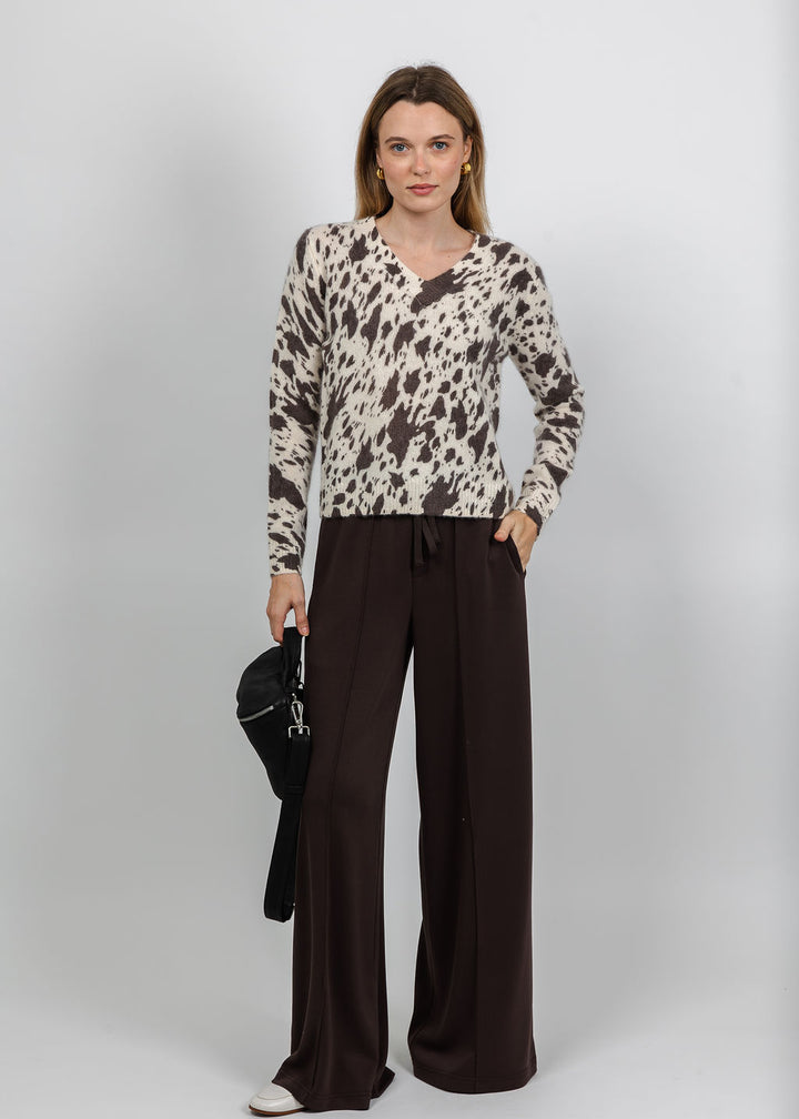 Kokun The Jasper Abstract V Neck Sweater in Ivory paired with Oui Marlene Drawstring Wide Leg Pant in Mulch available at Barbara Katz