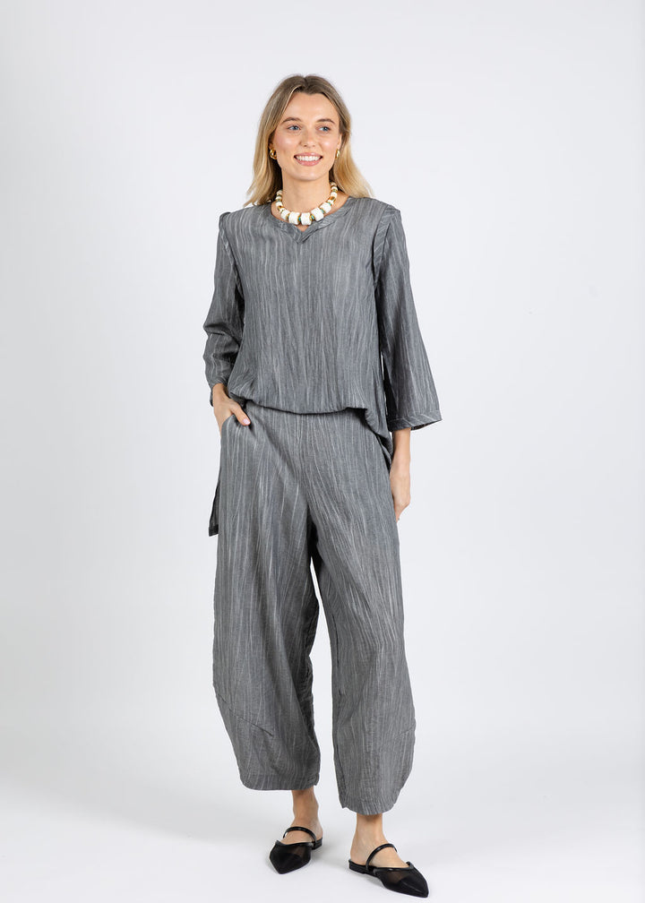Ozai N Ku Aida V-Neck Tunic in Grey paired with Ozai N Ku Karen Stripe Pants in Grey available at Barbara Katz