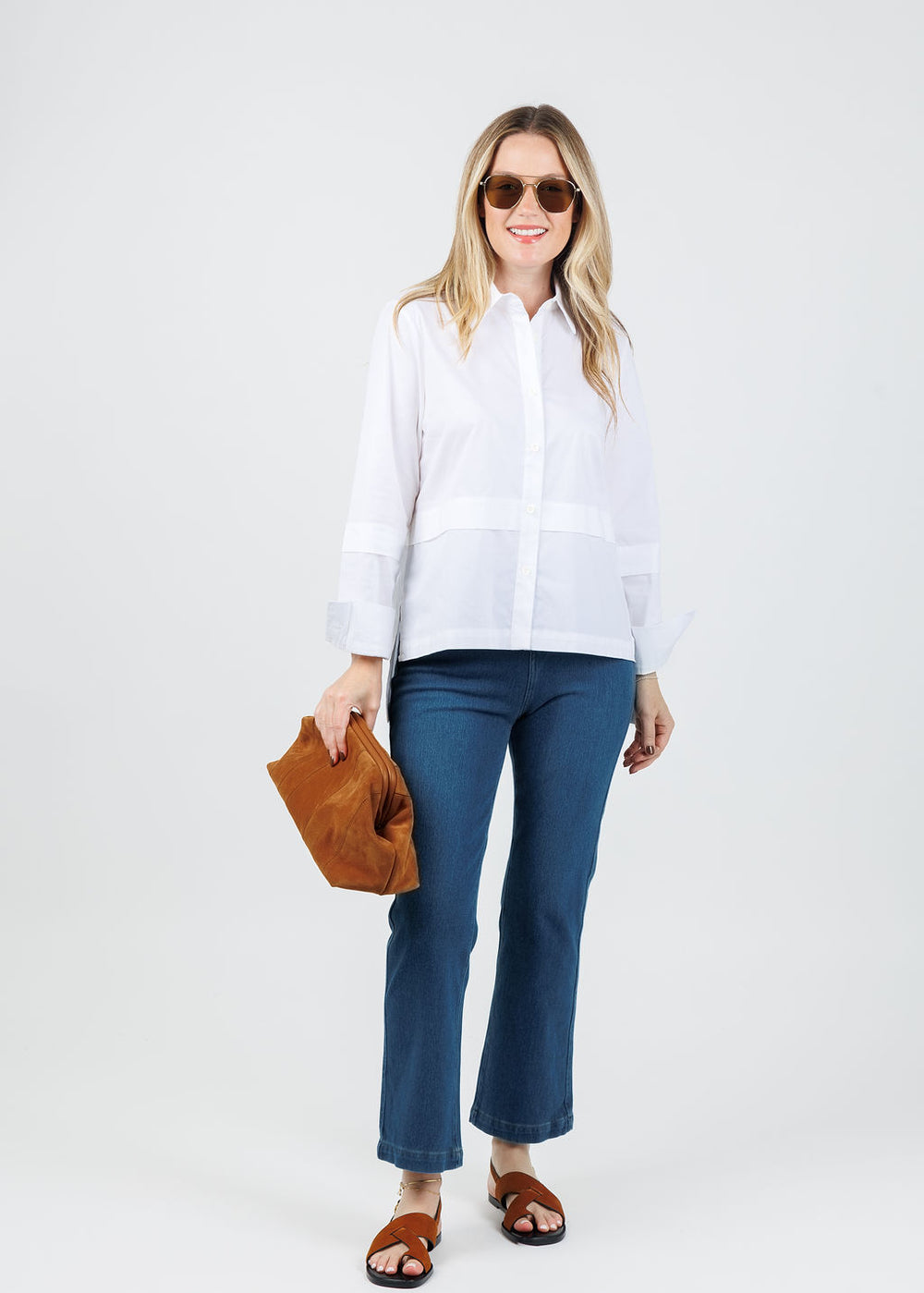 Ozai N Ku Nadia Button-Down High Low Shirt in White paired with Elliott Lauren Pull-On Stretch Denim Jeans available at Barbara Katz